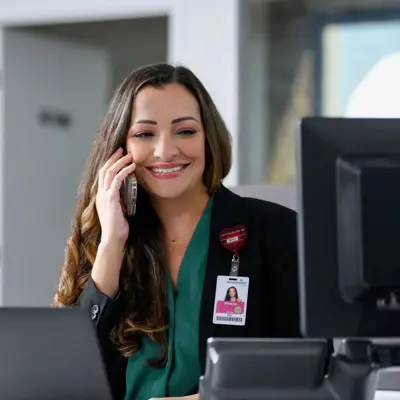 Health navigator on the phone helping patient.