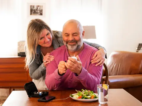 A man checking his blood sugar.
