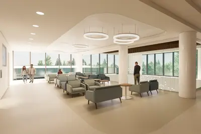 Modern hospital waiting area with contemporary seating arrangements, circular pendant lighting, floor-to-ceiling windows overlooking trees, and a textured stone accent wall