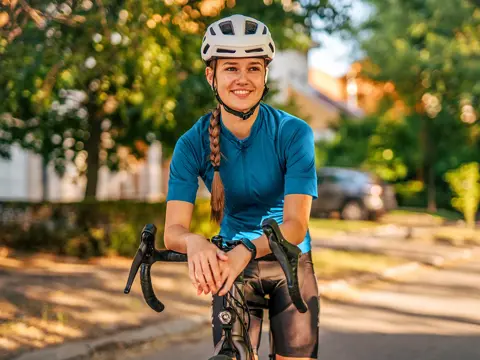 A Young Woman Riding her bike.