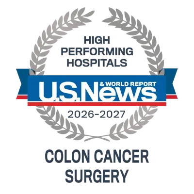 U.S. News and World Report 2026–2027 High Performing Hospitals badge for Colon Cancer Surgery with silver laurel wreath and blue ribbon.