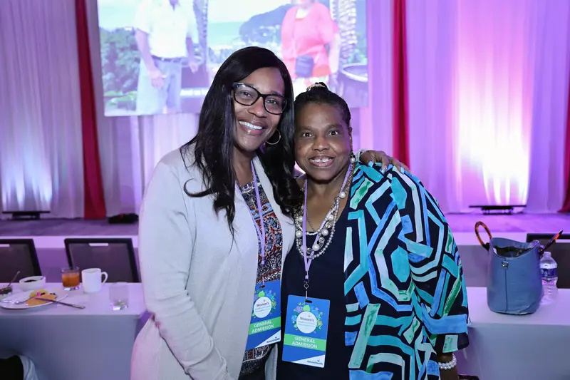 Two women smiling together at the AdventHealth Women’s Health and Cancer Prevention Event.