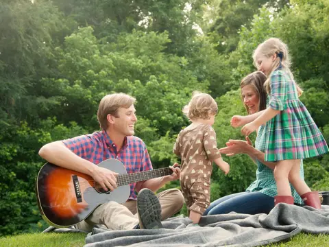Gordon Family out in the park jamming.
