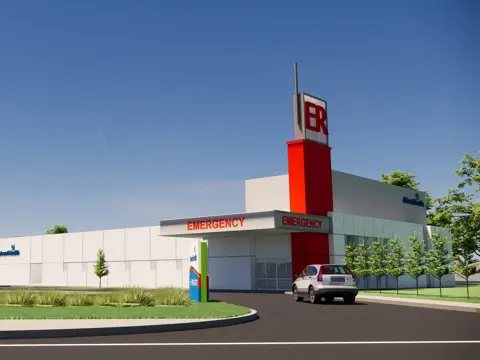 Architectural rendering of AdventHealth Auburndale Emergency Room facility exterior with prominent red ER tower, white building facade, and landscaped entrance