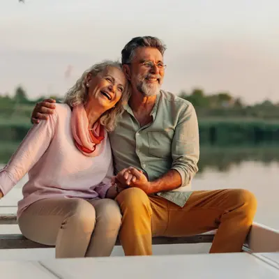 An older couple sitting in a boat.