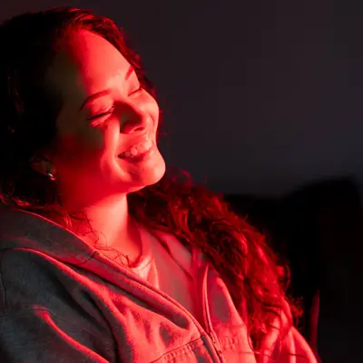 A woman receiving Red Light Therapy.