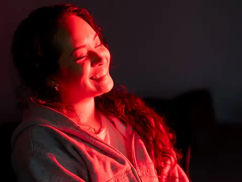 A woman receiving Red Light Therapy.