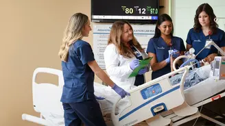 Nursing residents participating in a patient care simulation with an instructor in a clinical training lab.