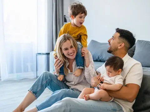 A happy family spending time together in the living room.