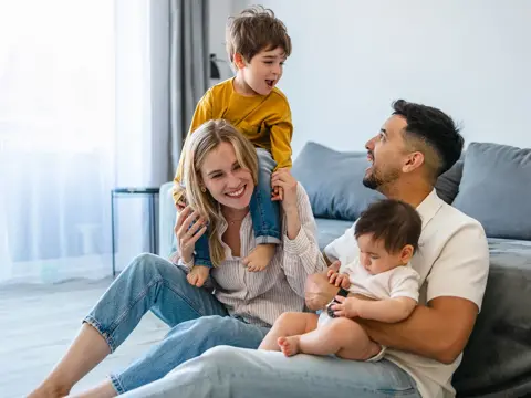 A happy family spending time together in the living room.