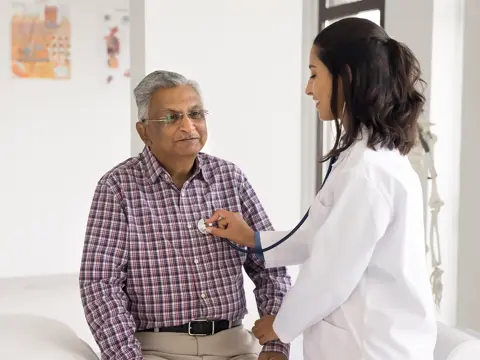Provider examining patient's heart