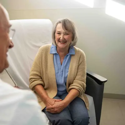 Woman speaking to doctor.