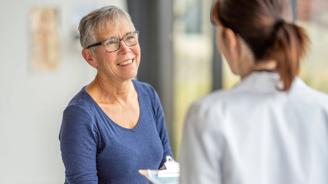 An older woman speaking to her doctor.