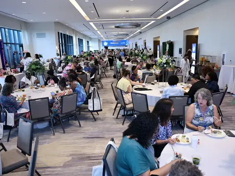 Attendees dining and socializing at the AdventHealth Women's Health and Cancer Prevention Event.