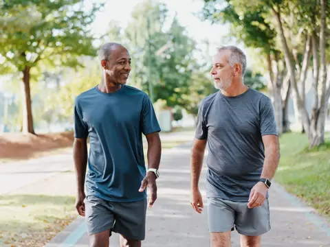 2026 Two men walking in a park / Lifestyle Photo DESKTOP 2000x1333