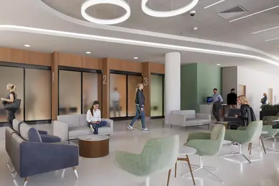 A modern health care facility registration area with numbered consultation rooms, comfortable seating in gray and green tones, and natural wood accents throughout the waiting space