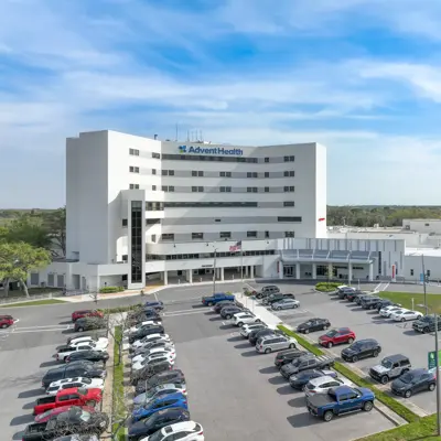 Aerial view of AdventHealth North Pinellas hospital building with parking lot