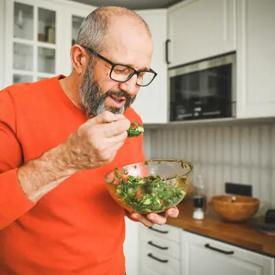 Man eating vegetable salad