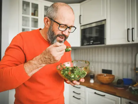Man eating vegetable salad