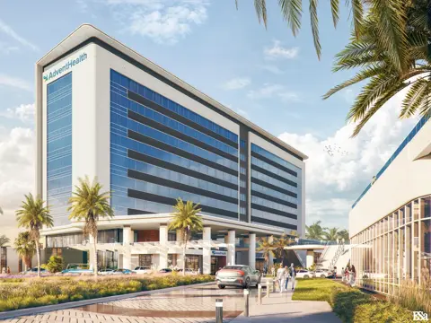 Architectural rendering of a modern AdventHealth medical facility featuring a multi-story glass and white exterior building with palm trees lining the entrance drive and visitors walking near the main entrance